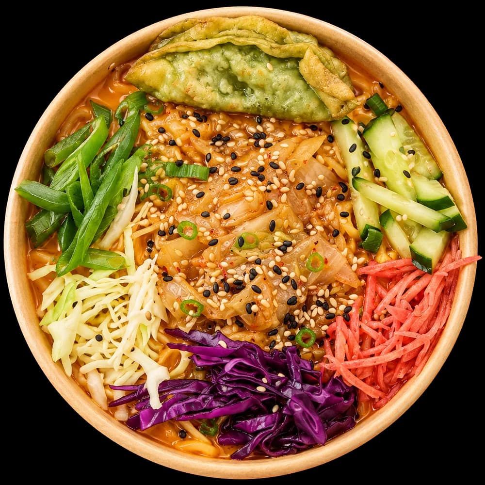 Top-down bowl of ramen topped with kimchi and sesame seeds